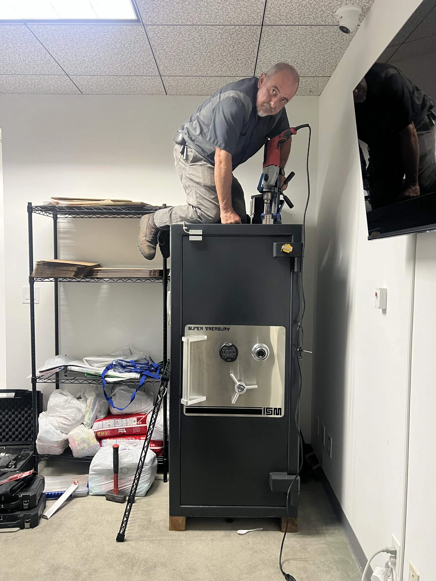 Jose working on a large high-security ISM Super Treasury safe